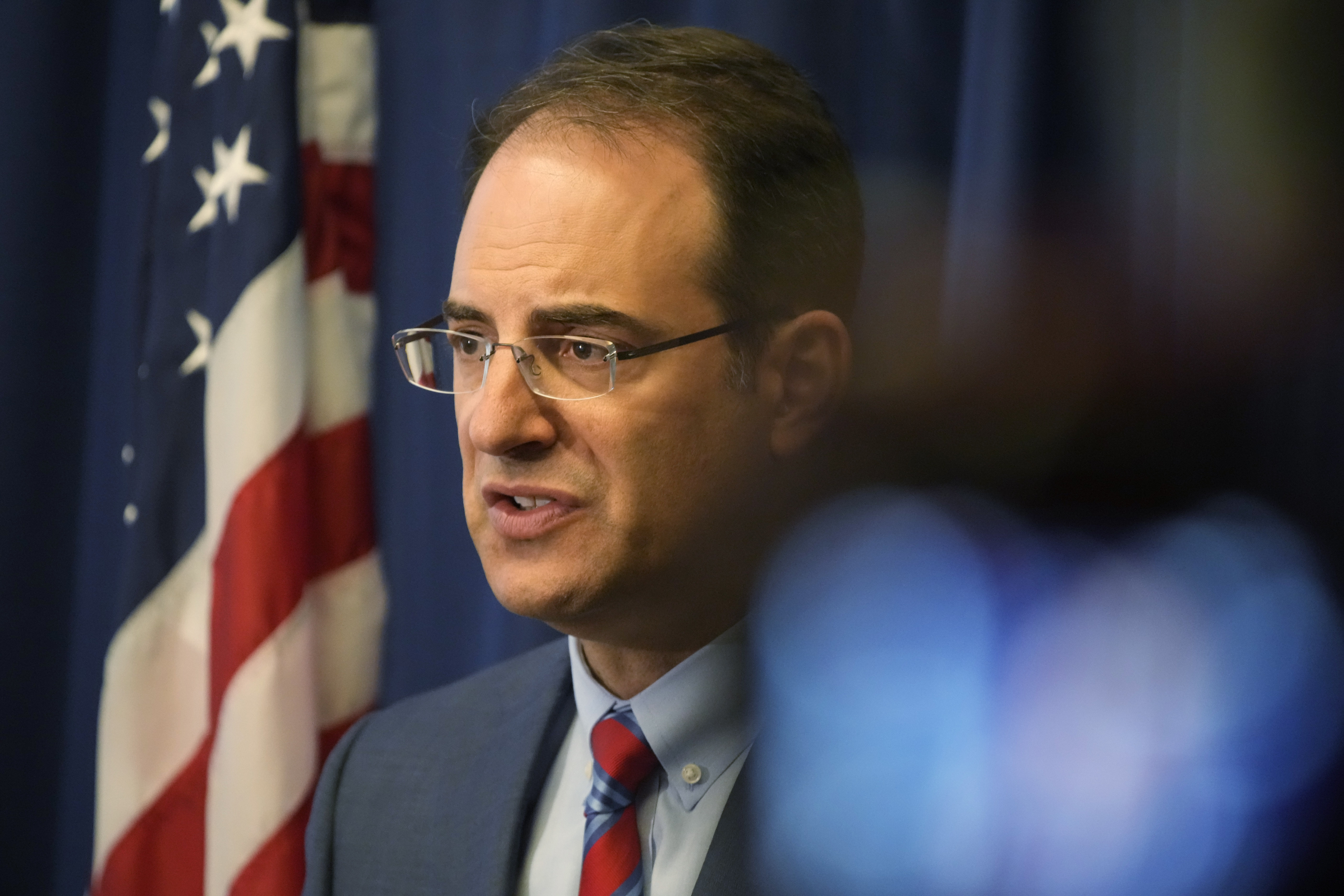 Phil Weiser speaking during a press conference.
