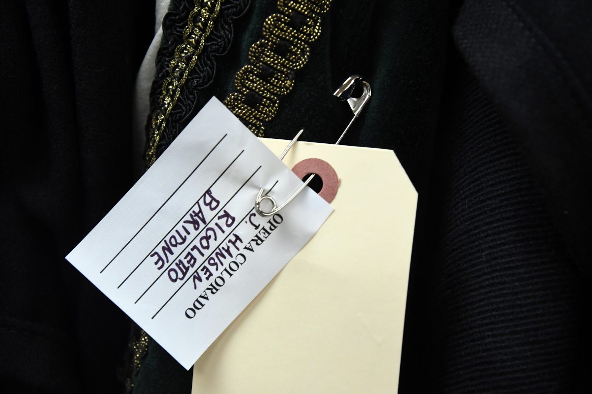 A tag attached to the green jacket.