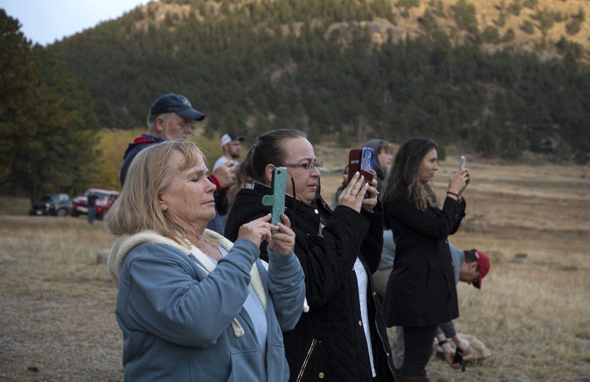 People take photos on their phone.