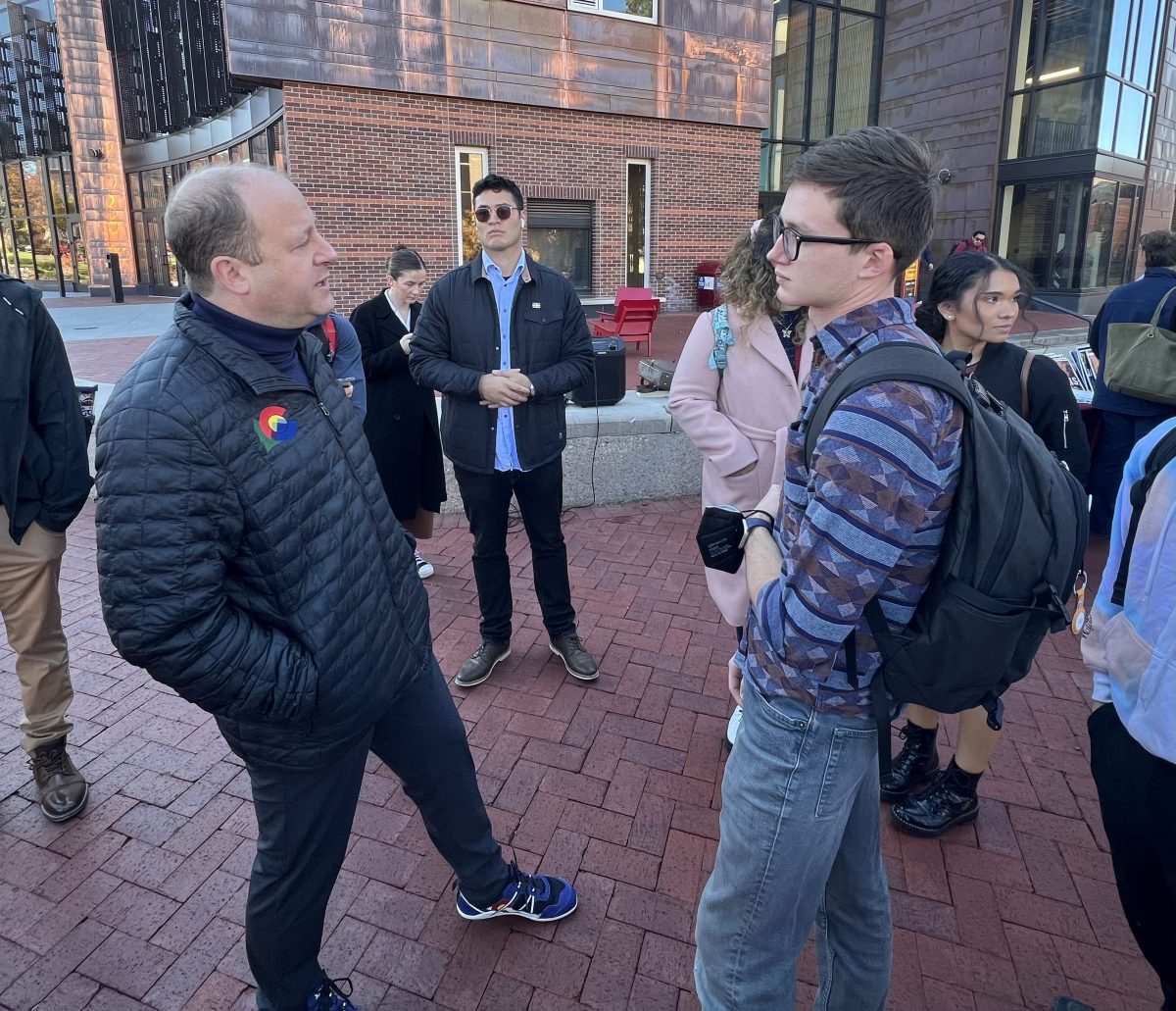 Jared Polis talks to DU student