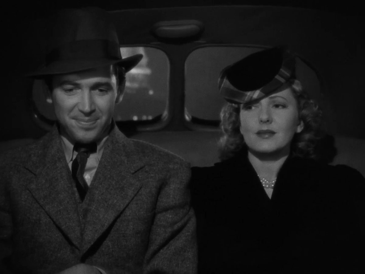 A man and woman sit next to each other in a car during the trailer of "Mr. Smith Goes to Washington."