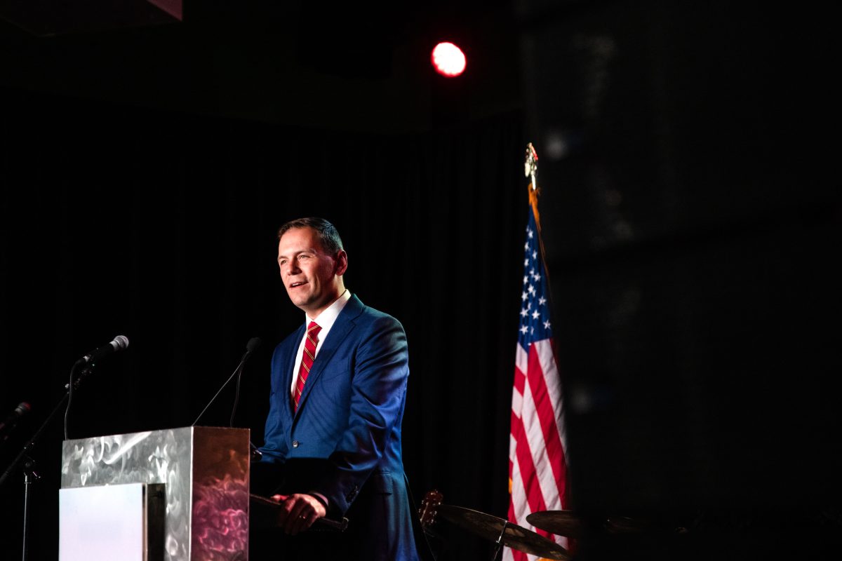 John Kellner stands at a podium.