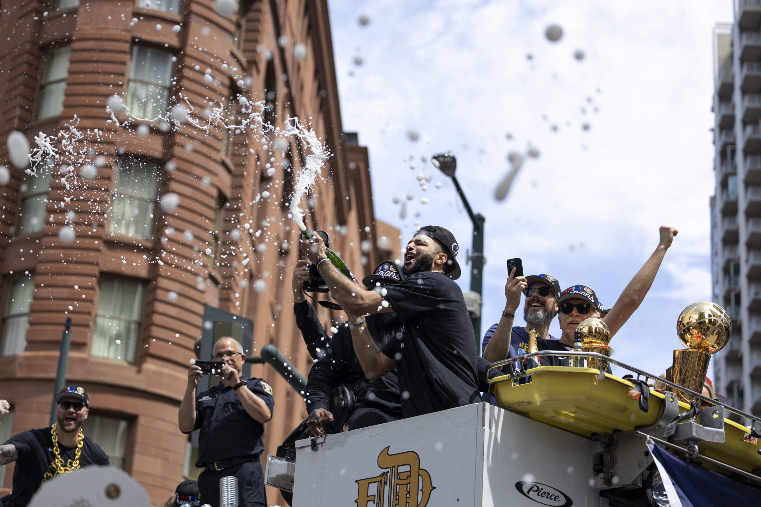 Denver police officer could lose leg after being hit by fire truck carrying Nuggets players during parade