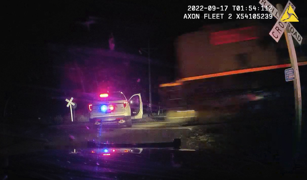 Colorado cop on trial for putting suspect in car hit by train says she didn’t notice the tracks