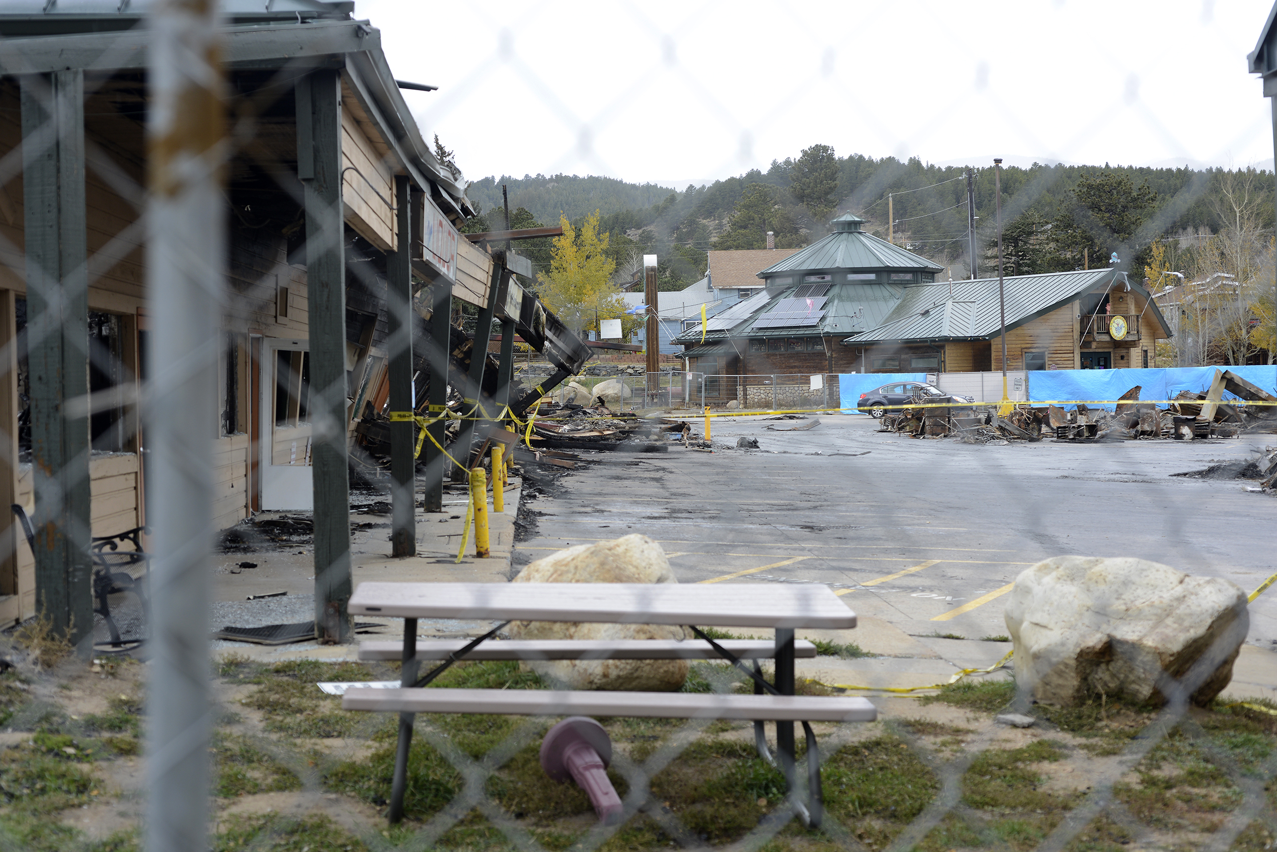 Debris and ash from burned-down Nederland shopping center swirl amid 90 mph winds, sparking health concerns